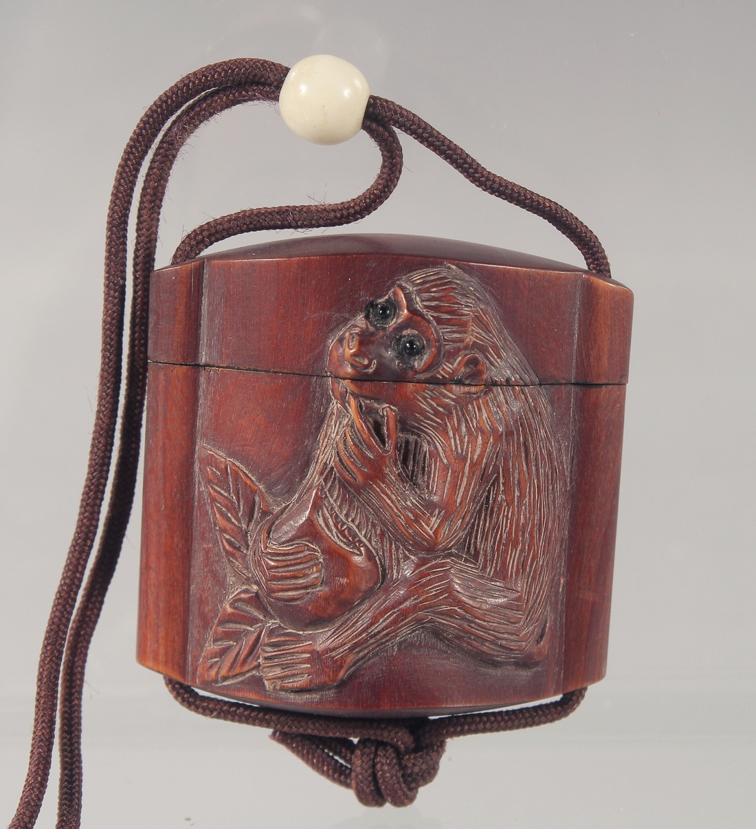 A SMALL CARVED WOOD MONKEY INRO. 4.5cm