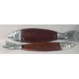 A PAIR OF HARDWOOD AND METAL MOUNTED FISH SHAPED SERVING PLATTERS. 35.5ins long.