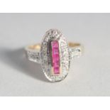 A 9ct. GOLD RUBY AND DIAMOND DECO STYLE RING.