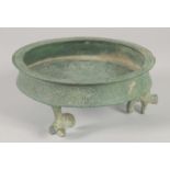 A RARE 12TH-13TH CENTURY PERSIAN SELJUK BRONZE FOOTED DISH, bearing the twelve zodiac symbols,