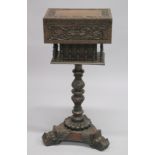 AN ANGLO-INDIAN WORK BOX ON STAND with a hinged top, above turned spindle supports, on a carved