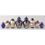A COLLECTION OF FOUR PAIRS OF JAPANESE COLBALT BLUE SATSUMA VASES / LIDDED JARS, (8 pieces).