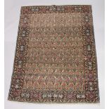 A GOOD PERSIAN CARPET, cream ground with an all over design of stylised Boteh, attached label; Barin