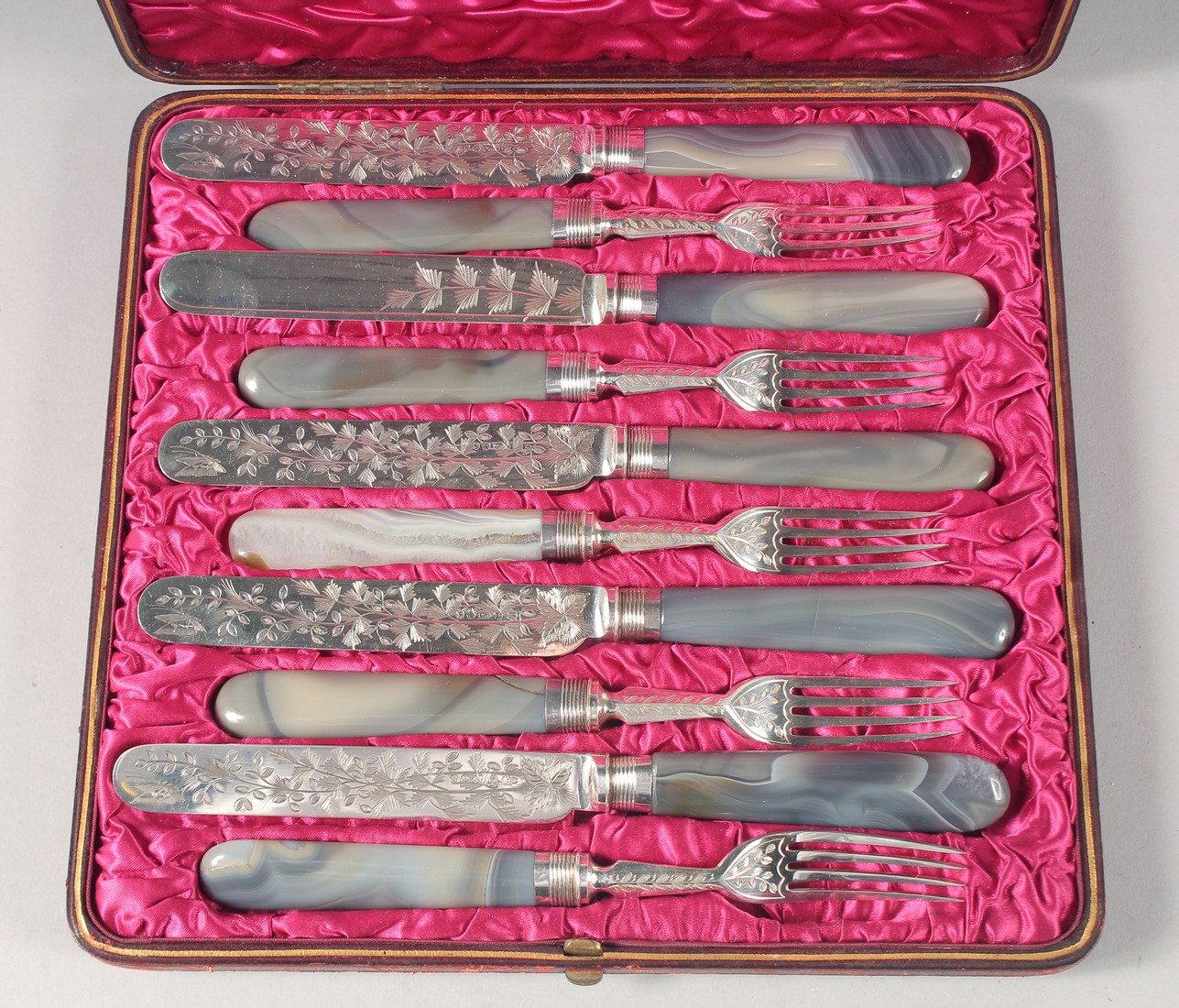 A GOOD SET OF SIX AGATE HANDLED KNIVES AND FORKS.