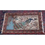 AN UNUSUAL PERSIAN OR INDIAN RUG, the pale cream ground decorated with a peacock in a landscape. 4'
