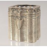 A DUTCH SILVER PILL BOX with ribbed decoration. 4cm high