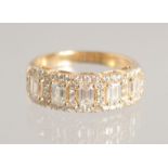 A SUPERB OCTAGONAL DIAMOND HALF HOOP RING set with 5 diamonds.