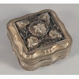 A DUTCH SILVER PILL BOX with embossed and engraved decoration. 5cm wide