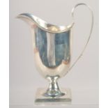 A HELMET SHAPED SILVER CREAM JUG. Sheffield 1900.