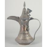 AN EARLY 20TH CENTURY SIGNED ARAB OMANI SILVER COFFEE POT DALLAH, weight 540g, 28cm high.