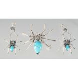 A SILVER TURQUOISE MARCASITE SPIDER BROOCH AND EARRINGS.