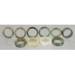 TEN VARIOUS JADE RINGS.