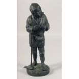 A JAPANESE BRONZE FIGURE OF A MAN HOLDING A PIPE, leaning on a hoe. 12ins high.