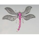 A SILVER RUBY SET DRAGONFLY BROOCH.