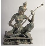 A LARGE 19TH CENTURY THAI RATTANAKOSIN DYNASTY BRONZE of Saraswati playing a vina, seated upon a