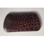 AN ASPREYS CROCODILE SKIN SPECTACLE CASE.