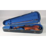 A CASED VIOLIN AND BOW.