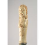 A WALKING STICK WITH CARVED BONE HANDLE modelled as a woman.