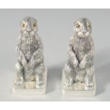 A PAIR OF SILVER-PLATED RABBIT SALT AND PEPPERS. 5.5cm