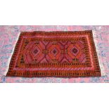 A SMALL PERSIAN DESIGN RUG, with three large central medallions. 4'6" x 2'10"