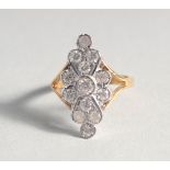 A GOLD-PLATED SILVER CUBIC ZIRCONIA CLUSTER RING.