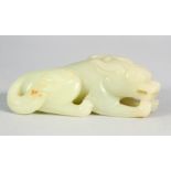 A CHINESE CARVED JADE CROUCHING LION. 9cm long.
