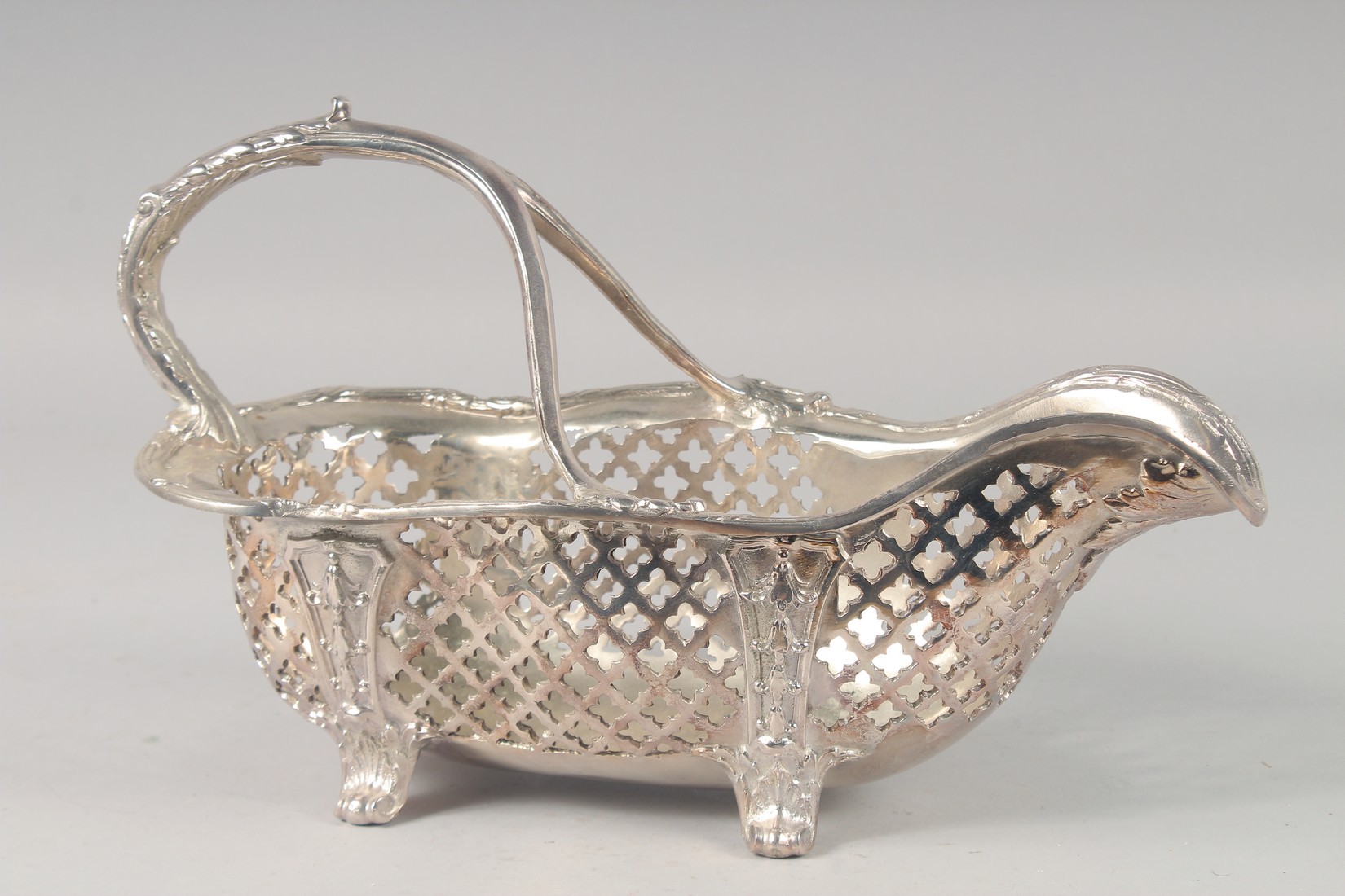 AN ORNATE SILVER-PLATED BOTTLE CARRIER/POURER - Image 2 of 2