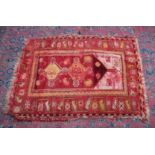 A SMALL PERSIAN RUG, rust ground with stylised decoration. 4'2" x 3'2"