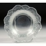 A LALIQUE GLASS BOWL the rim moulded as a band of leaves. 6.5ins diameter.