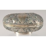 A CHINESE SILVER OVAL BOX with embossed and engraved decoration. 7.5cm.