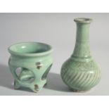A CHINESE CELADON VASE, 7ins high and a stand, 3.5ins.