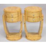 A PAIR OF ART DECO STYLE CIRCULAR TWO DRAWER BEDSIDE TABLES. 1ft 4ins diameter x 2ft 4ins high.