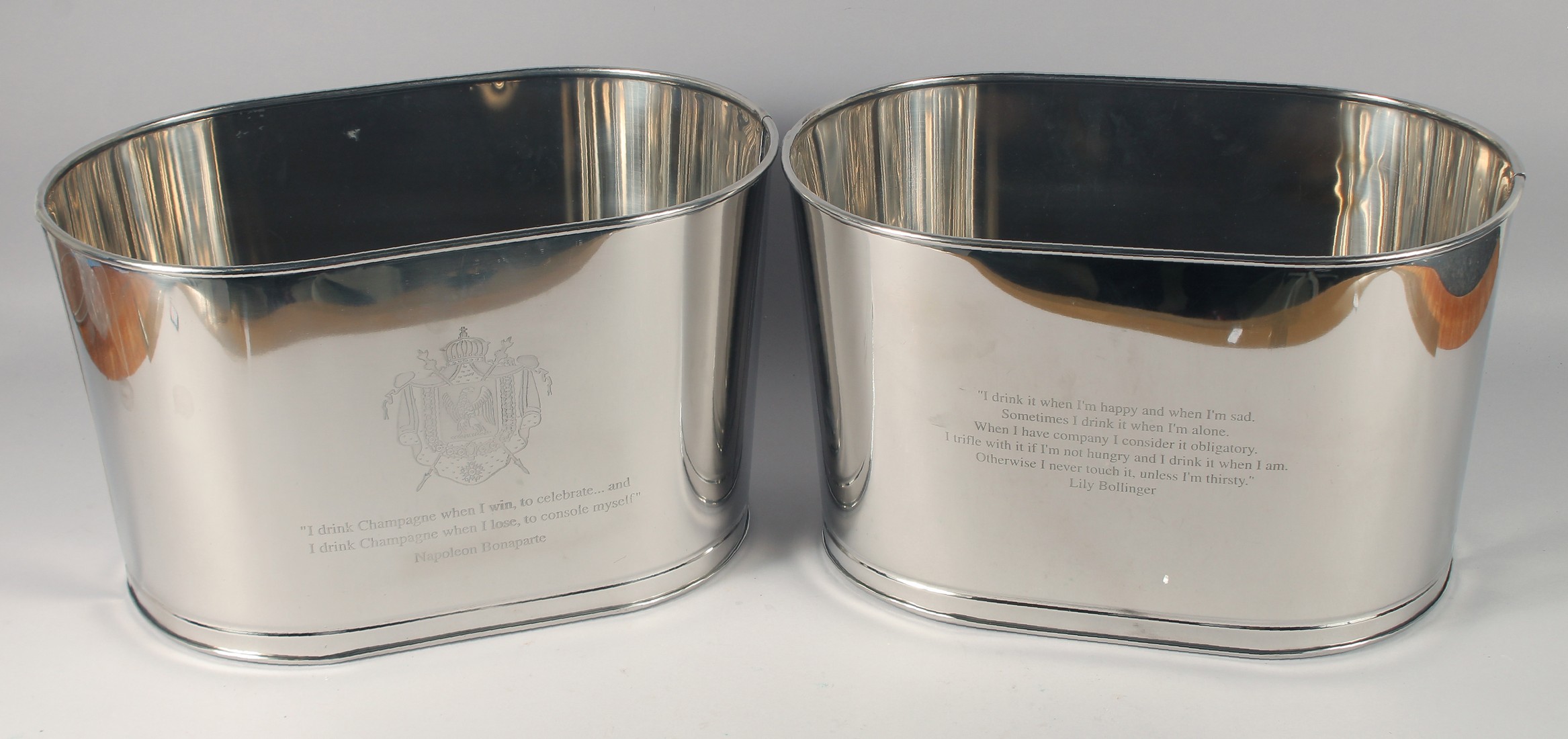 A PAIR OF OVAL METAL CHAMPAGNE COOLERS. 17" long