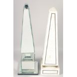 TWO OBELISKS, one mother-of-pearl, the other glass. 22ins high.