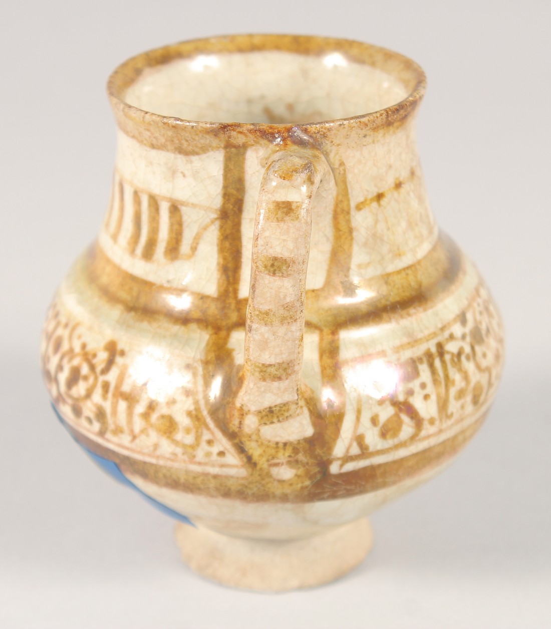 A SMALL KASHAN LUSTRE GLAZE POTTERY EWER, with provenance sticker; Christie's, 9cm high. - Image 2 of 7