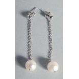 A PAIR OF SILVER AND PEARL LONG DROP EARRINGS.