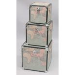 A GRADUATED SET OF THREE TRUNKS, the exteriors decorated with maps. Largest trunk: 1ft 6ins square.