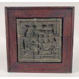 A CARVED STONE TEMPLE TILE, framed, tile 19cm square.