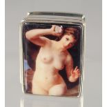 A SMALL MODERN SILVER PILL BOX, with enamel decoration of a reclining female nude. 3cm x 2.5cm