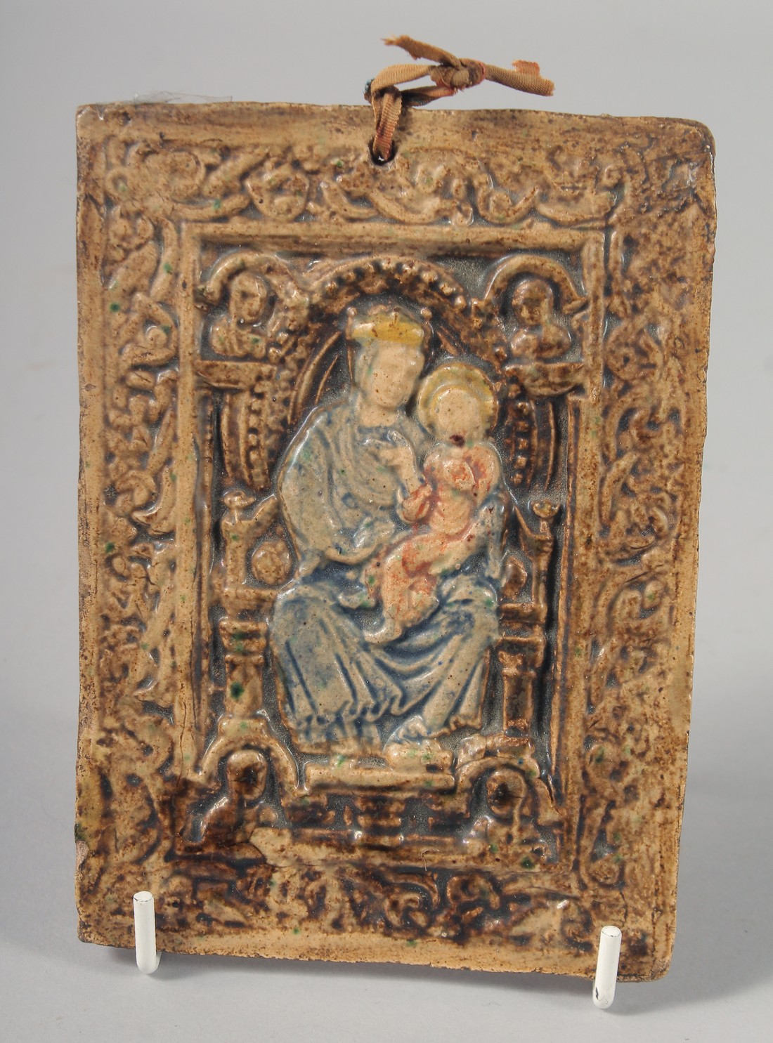 A MAJOLICA POTTERY MADONNA AND CHILD 5.75ins high.