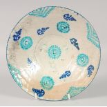 AN EASTERN GLAZED POTTERY BOWL, with turquoise decorative motifs, 26cm diameter.