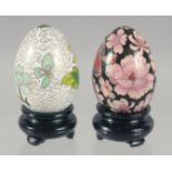 TWO CLOISONNE EGGS on stand.