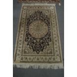 A GOOD PERSIAN DESIGN PART SILK RUG, pale cream and blue ground with stylised floral decoration. 5'