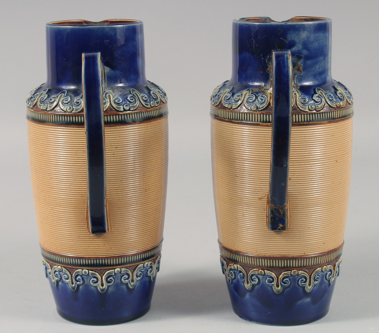 A PAIR OF ROYAL DOULTON STONEWARE JUGS with blue bands. 8ins high. - Image 2 of 6