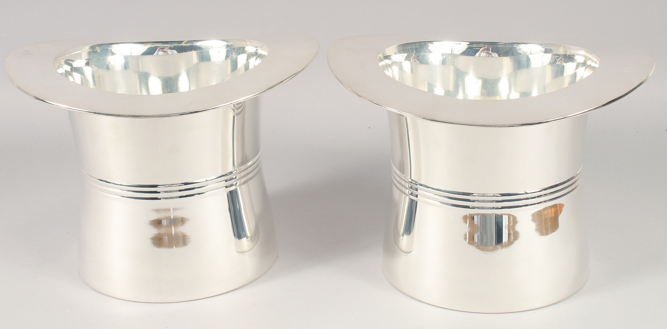 A PAIR OF PLATED 'TOP HAT' WINE COOLERS. 7" high