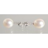 A GOOD PAIR OF PEARL AND DIAMOND DROP EARRINGS. 11mm pearls.