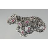 A SILVER RUBY AND MARCASITE PANTHER BROOCH.