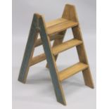 A PAIR OF NOVELTY WOODEN STEPS. 2ft 10ins high.