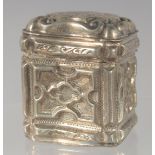 A DUTCH SILVER PILL BOX with embossed decoration. 4.5cm high