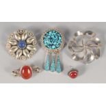 FOUR VARIOUS SILVER BROOCHES.